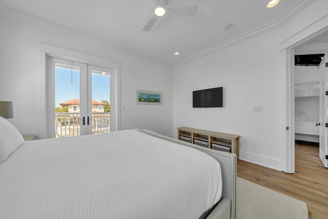 bedroom with french doors, wood-type flooring, access to exterior, ceiling fan, and ornamental molding