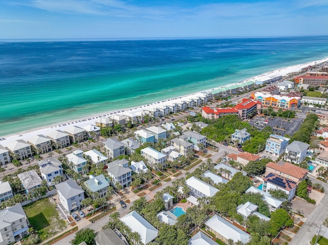 aerial view with a water view and a view of the beach