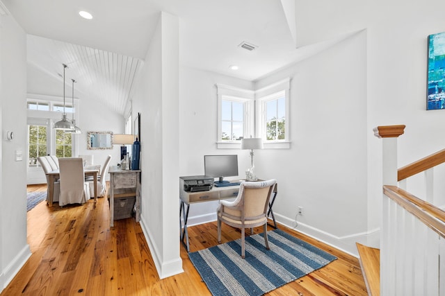 office area featuring lofted ceiling and hardwood / wood-style flooring