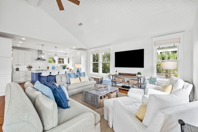 living room with wooden ceiling, sink, high vaulted ceiling, ceiling fan, and light wood-type flooring