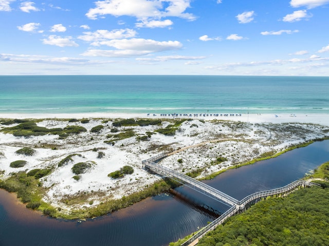 birds eye view of property with a view of the beach and a water view