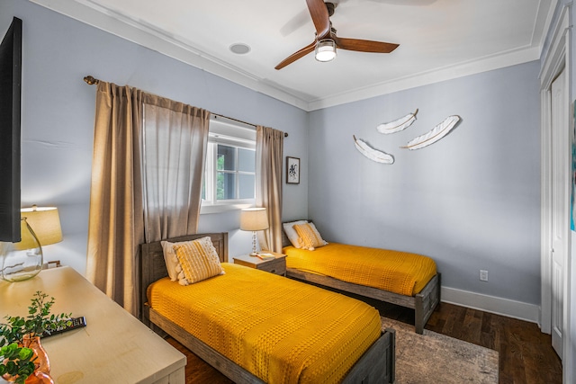 bedroom with crown molding, dark wood-type flooring, and ceiling fan