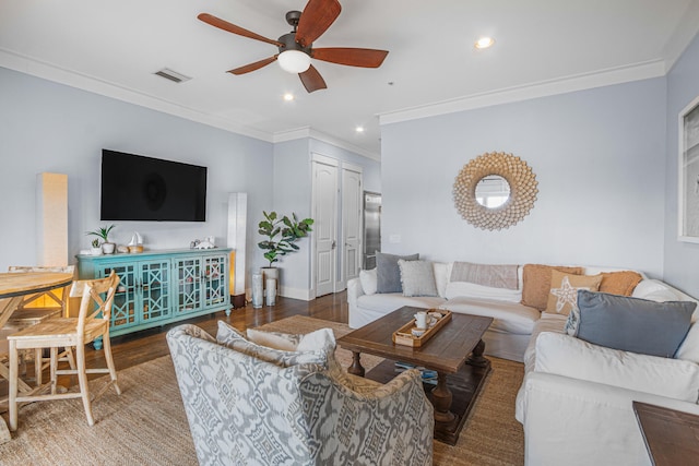 living room featuring crown molding, hardwood / wood-style flooring, and ceiling fan