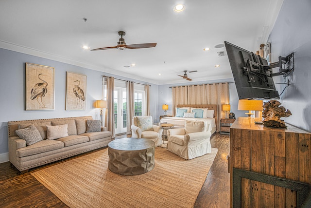 living room with crown molding, dark wood-type flooring, and ceiling fan