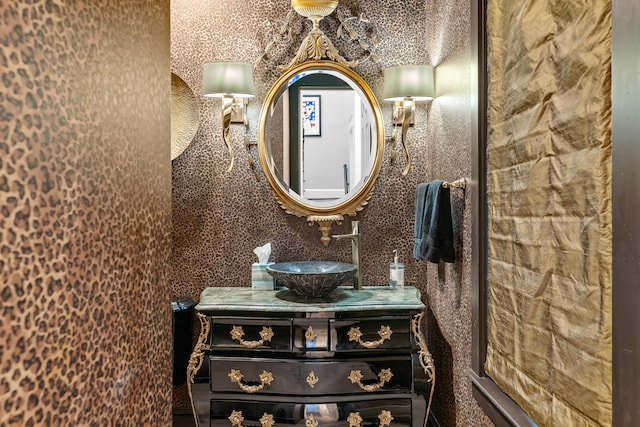 bathroom featuring a textured ceiling and vanity