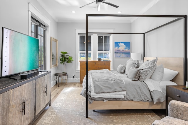 bedroom with ceiling fan, light hardwood / wood-style flooring, and crown molding