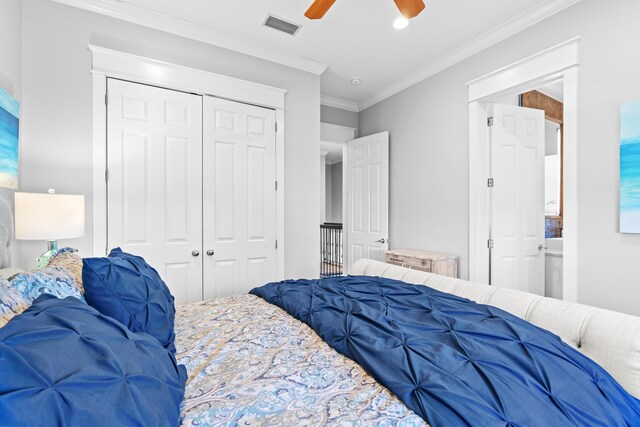 bedroom featuring ceiling fan, a closet, and ornamental molding