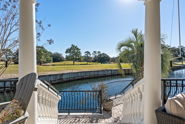 exterior space featuring a yard and a water view