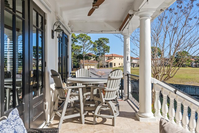 balcony with ceiling fan and a patio area