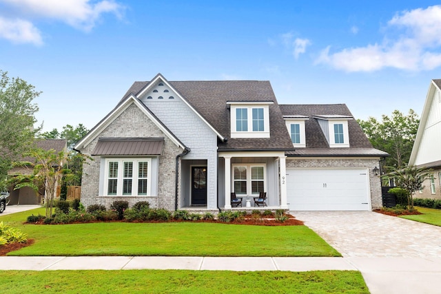 view of front of house with a front lawn and a garage