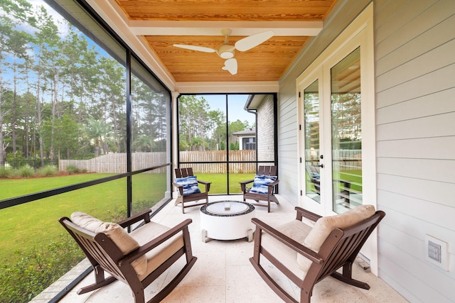 sunroom / solarium with wooden ceiling and ceiling fan