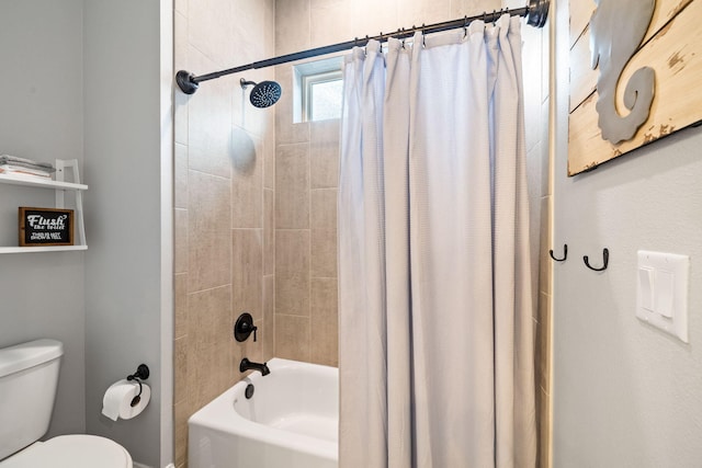 bathroom with toilet and shower / bath combo with shower curtain