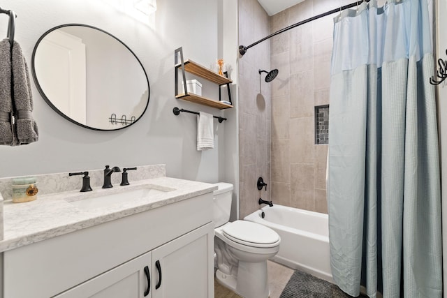 full bathroom featuring vanity, shower / tub combo, and toilet