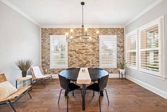 dining area featuring a chandelier, dark wood-type flooring, and crown molding