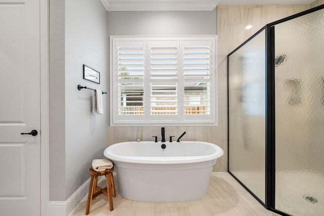 bathroom featuring ornamental molding and plus walk in shower