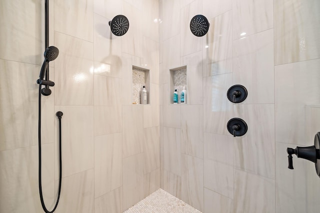 bathroom with a tile shower