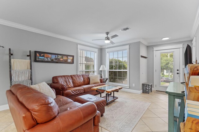 living room featuring ceiling fan, ornamental molding, and light tile patterned floors