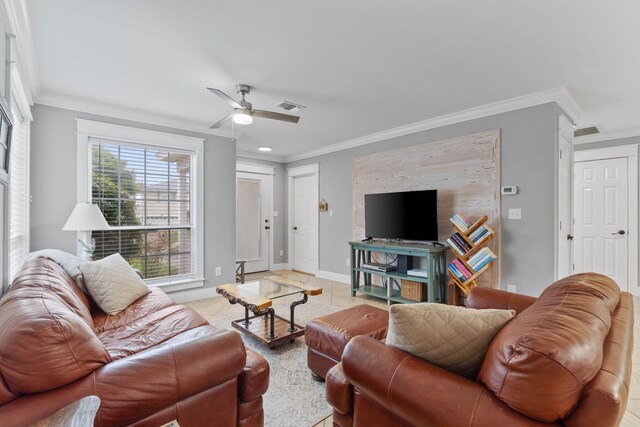 living room with tile patterned flooring, crown molding, and ceiling fan