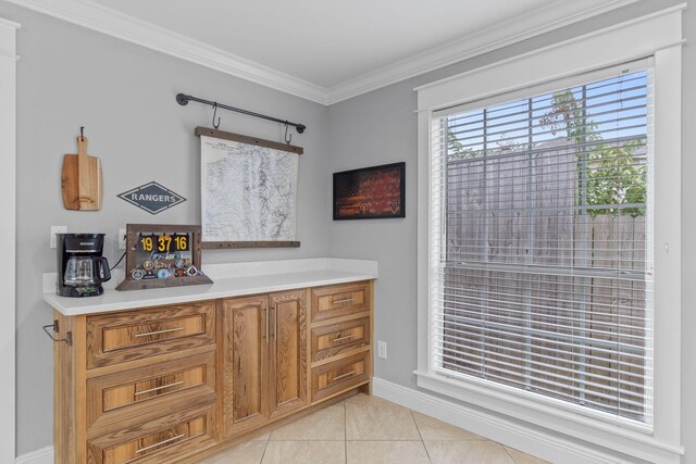 bathroom with ornamental molding and tile patterned flooring