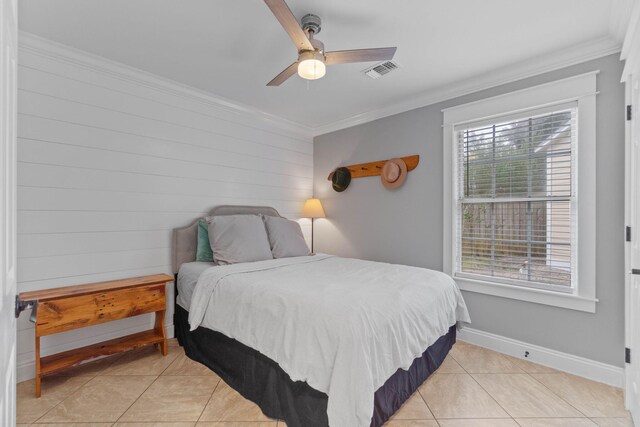 tiled bedroom with multiple windows, ceiling fan, and crown molding