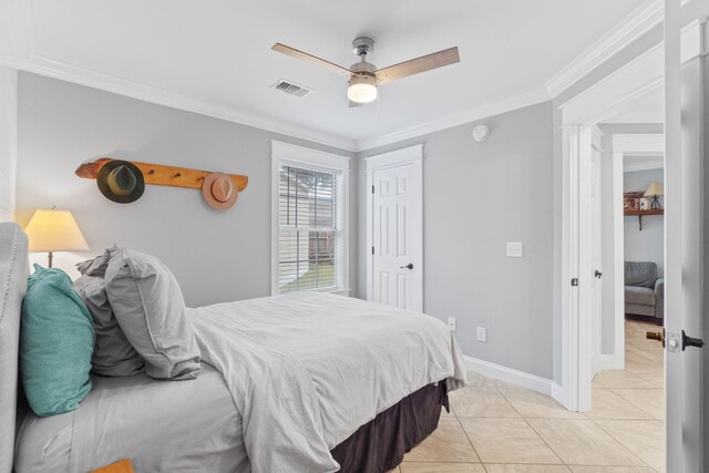 tiled bedroom with crown molding and ceiling fan