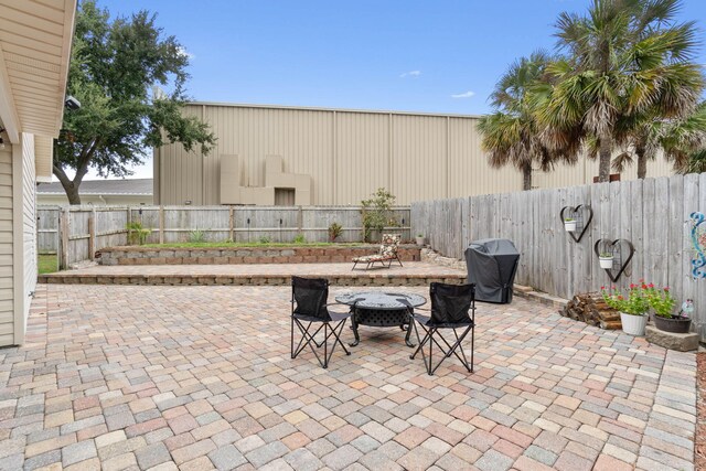 view of patio featuring a grill