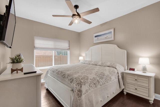 bedroom featuring ceiling fan and dark hardwood / wood-style floors