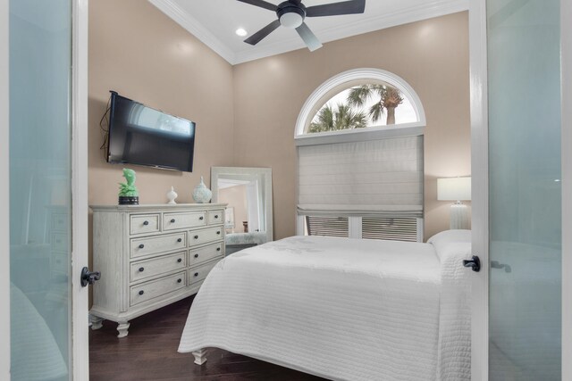 bedroom with ceiling fan, crown molding, and dark hardwood / wood-style floors