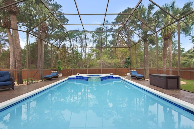 view of pool featuring a lanai, a patio area, and an in ground hot tub