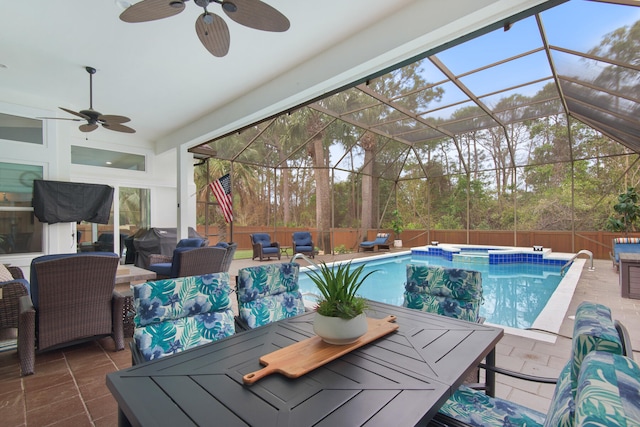 view of pool featuring ceiling fan, a patio, and glass enclosure