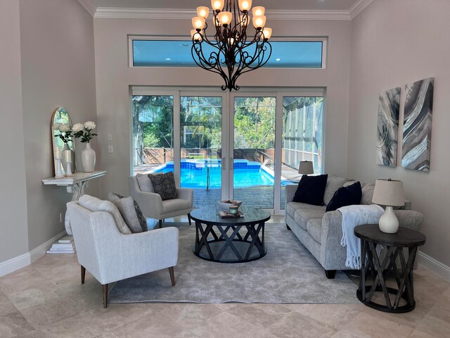 living room with a healthy amount of sunlight, crown molding, and a chandelier