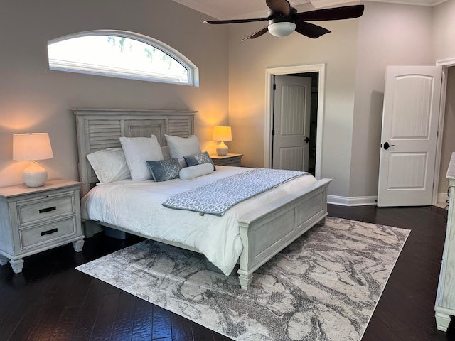 bedroom featuring dark hardwood / wood-style floors, ceiling fan, and ornamental molding