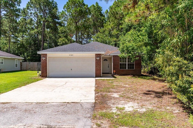 ranch-style home featuring a garage and a front lawn