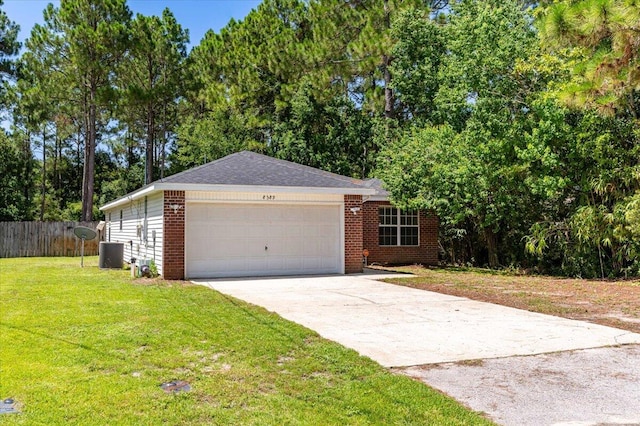 single story home with central air condition unit, a front lawn, and a garage