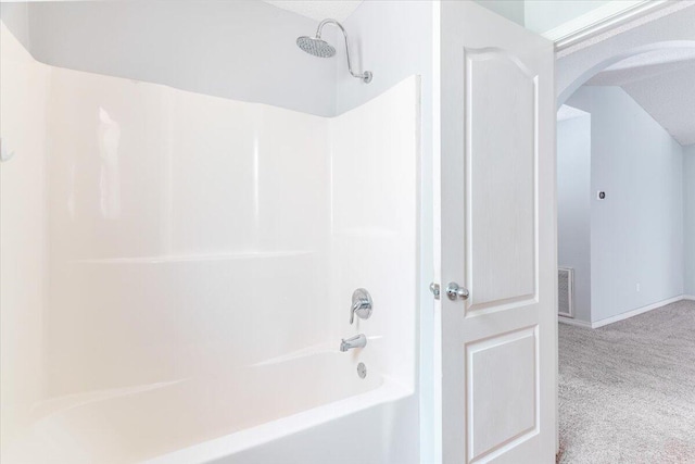 bathroom featuring shower / tub combination and a textured ceiling