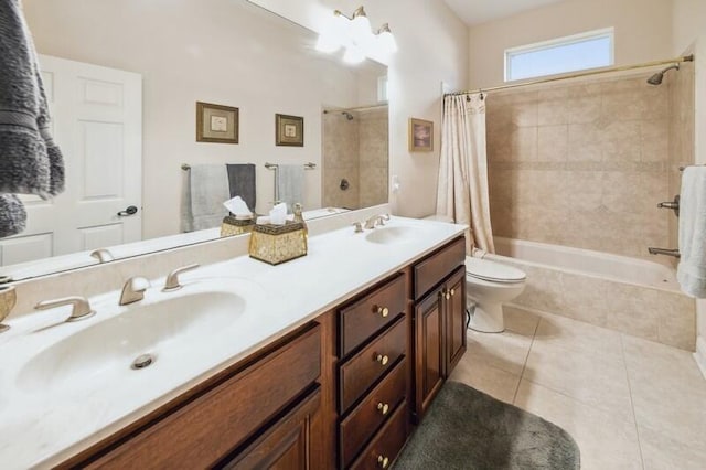 full bathroom featuring vanity, toilet, tile patterned floors, and shower / tub combo