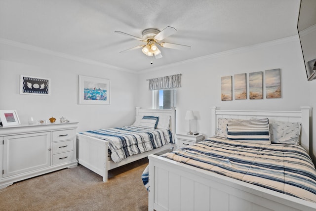 carpeted bedroom with ceiling fan and ornamental molding