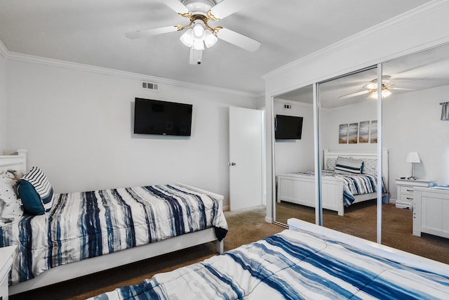 bedroom featuring dark carpet, a closet, ceiling fan, and crown molding