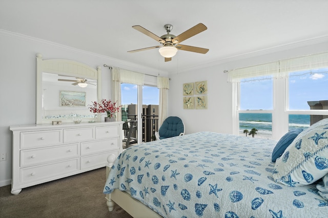 bedroom featuring dark carpet, access to exterior, crown molding, ceiling fan, and a water view