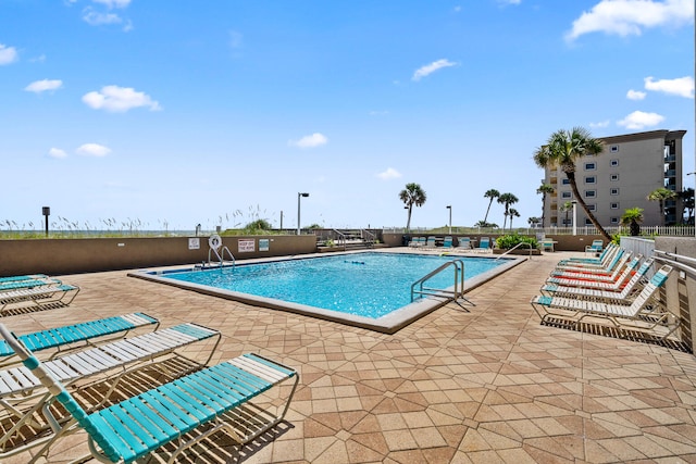 view of pool featuring a patio