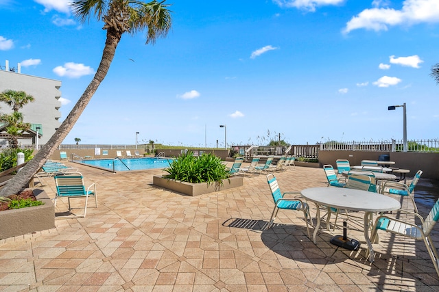 view of pool featuring a patio area