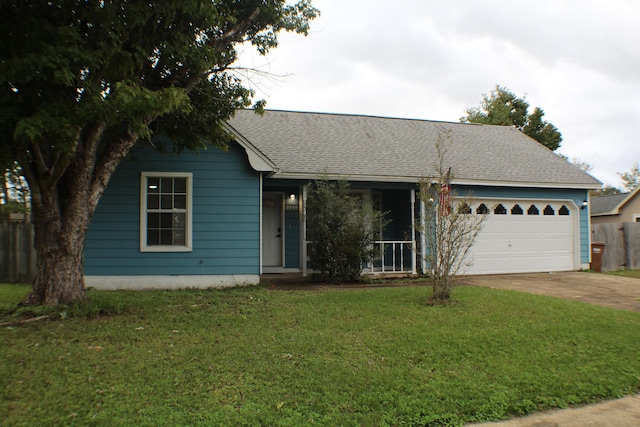 single story home featuring a garage and a front yard