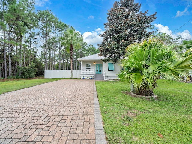 view of front of home featuring a front lawn and covered porch