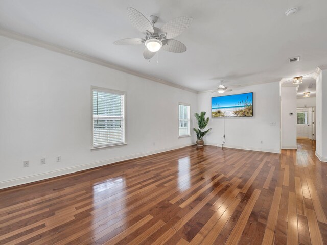 unfurnished living room featuring wood-type flooring, crown molding, and ceiling fan