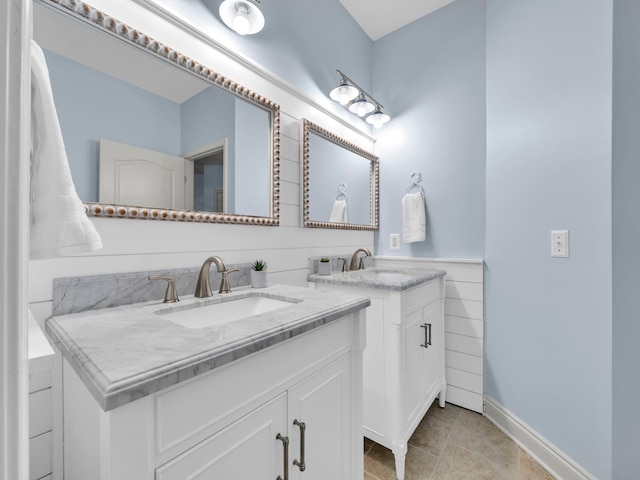 bathroom with tile patterned flooring and vanity