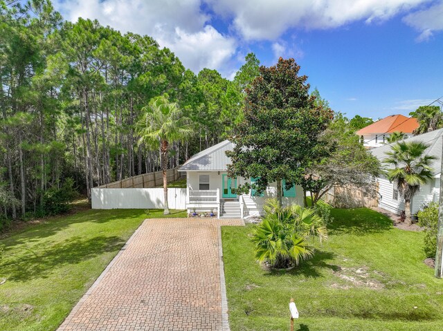 view of front of home with a front lawn and a porch