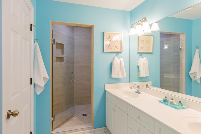 bathroom with vanity and an enclosed shower