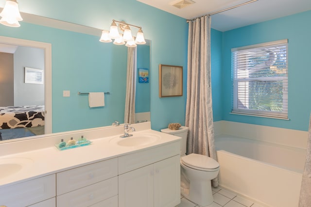 bathroom with toilet, vanity, tile patterned floors, and a bath