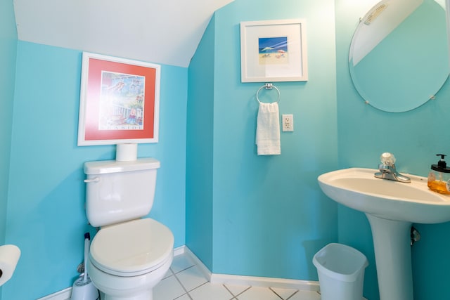 bathroom featuring toilet and tile patterned flooring