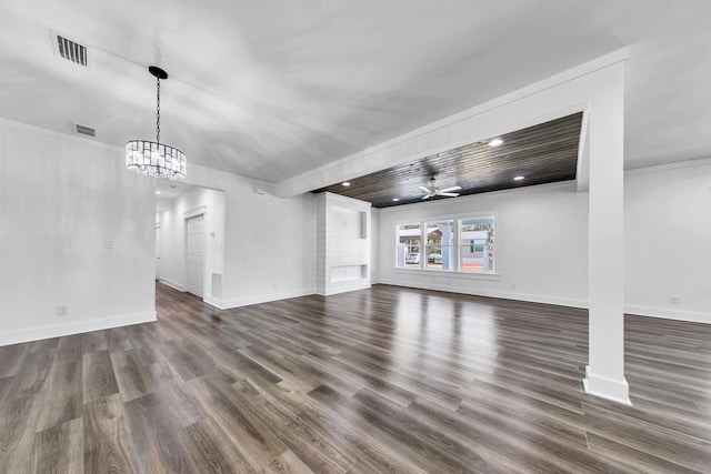 unfurnished living room with crown molding, dark hardwood / wood-style flooring, and ceiling fan with notable chandelier